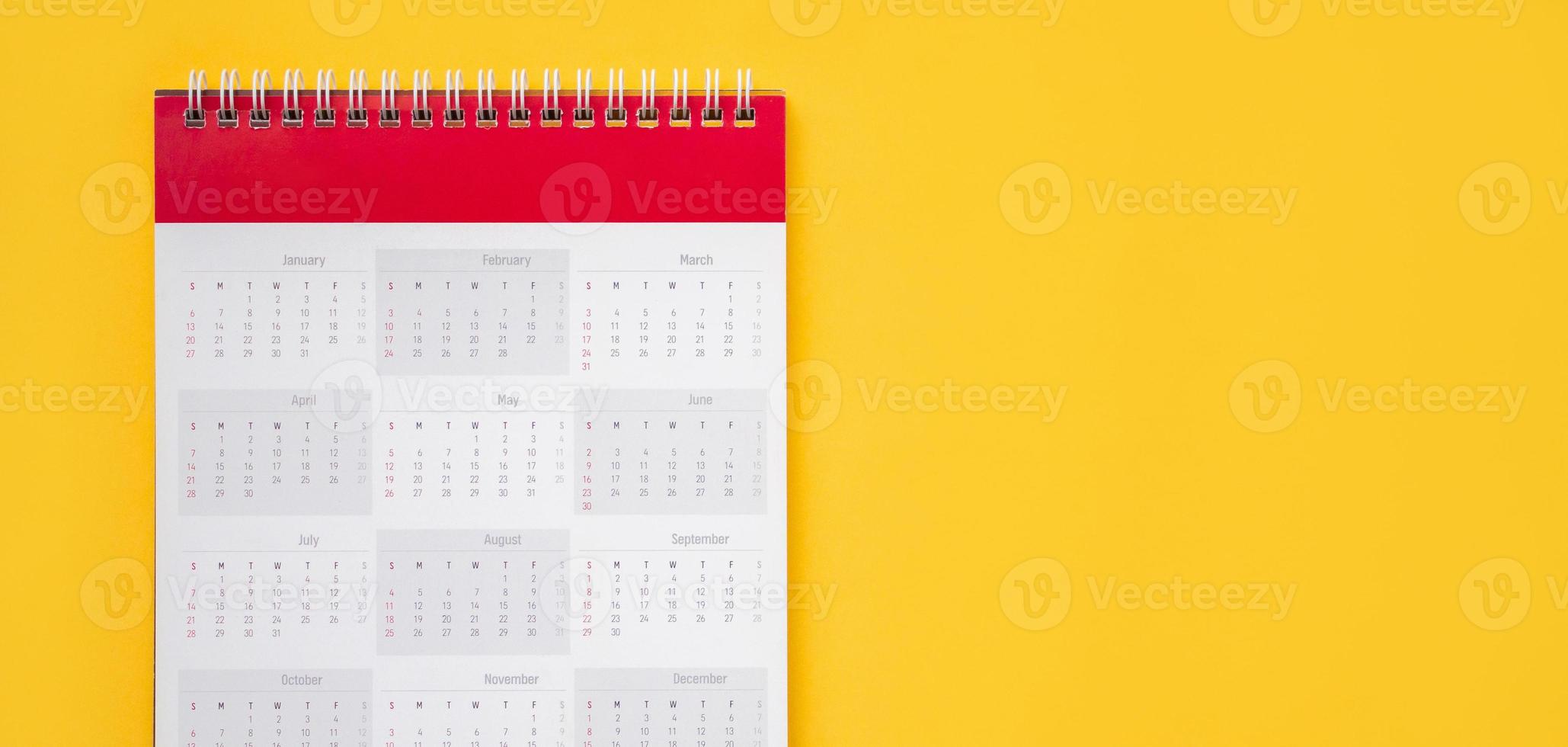 calendar page on yellow background business planning appointment meeting concept photo