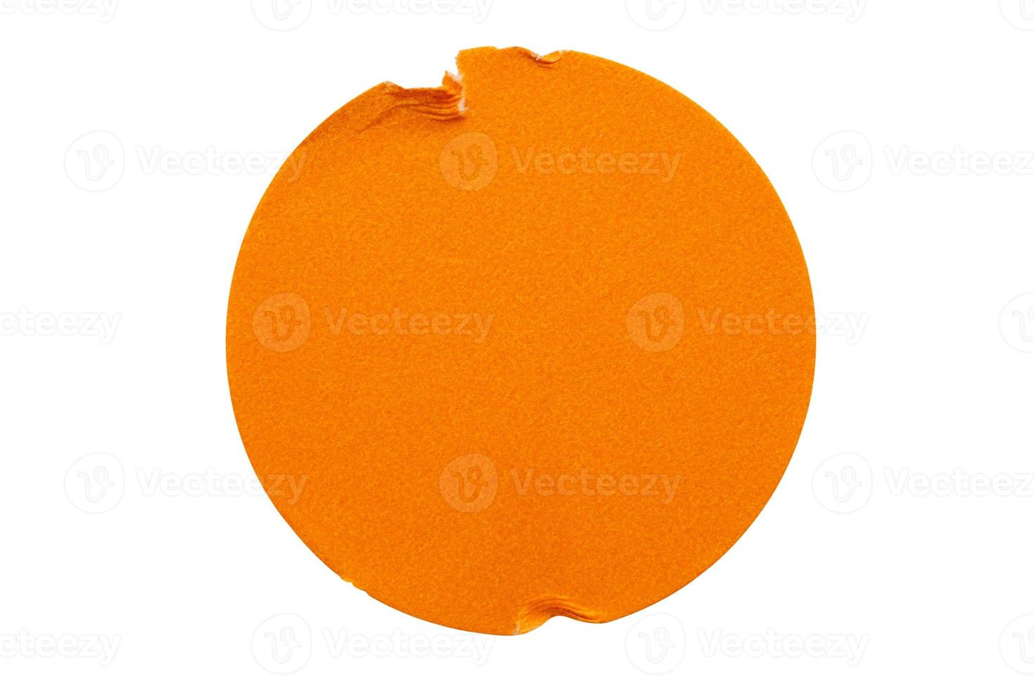 Blank orange round adhesive paper sticker label isolated on white background photo