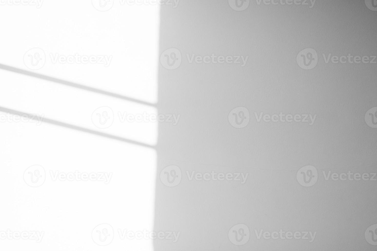 Window shadow drop on white wall background photo