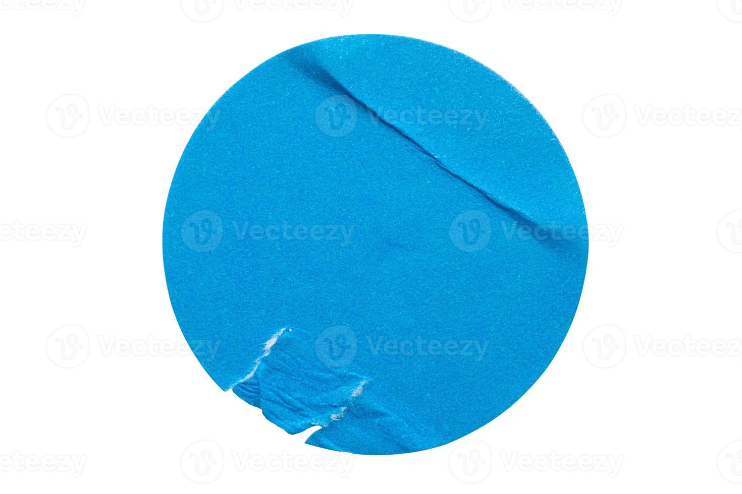 Blank blue round adhesive paper sticker label isolated on white background photo