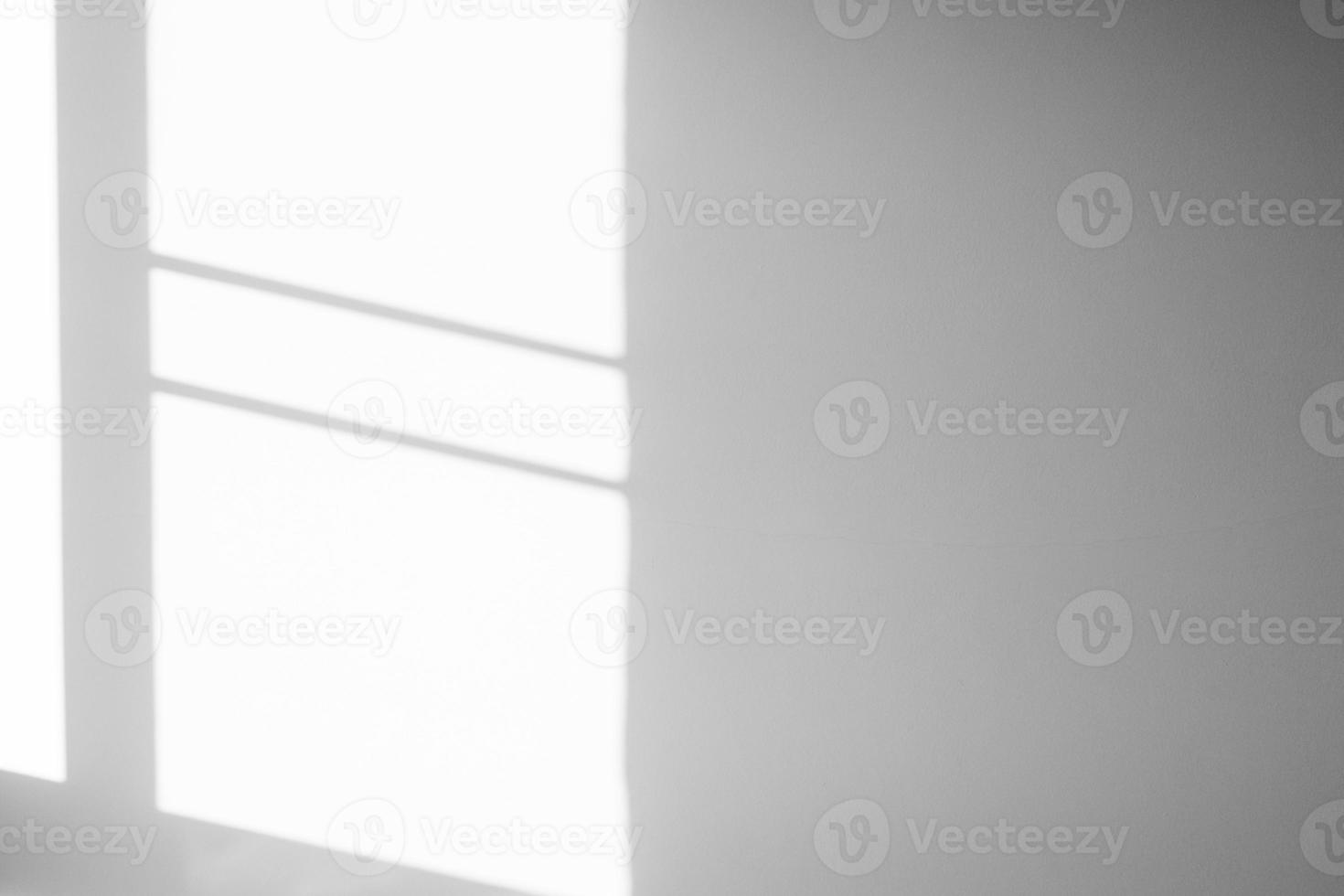 Window shadow drop on white wall background photo