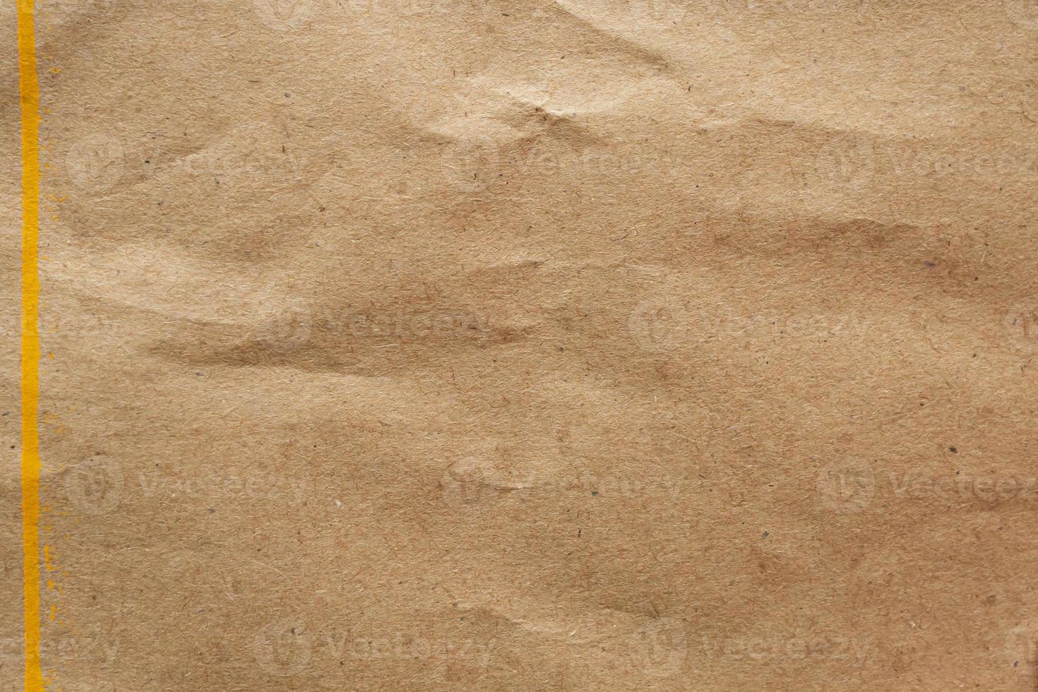 Brown crumpled paper recycled kraft sheet texture background photo