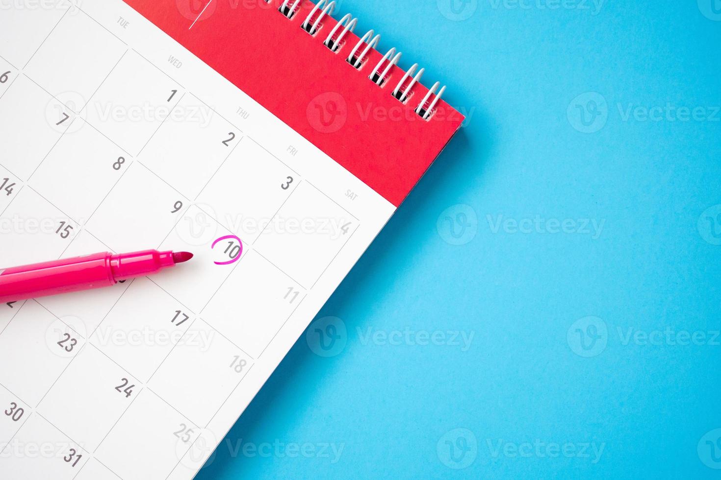 important appointment schedule write on white calendar page date on blue background photo