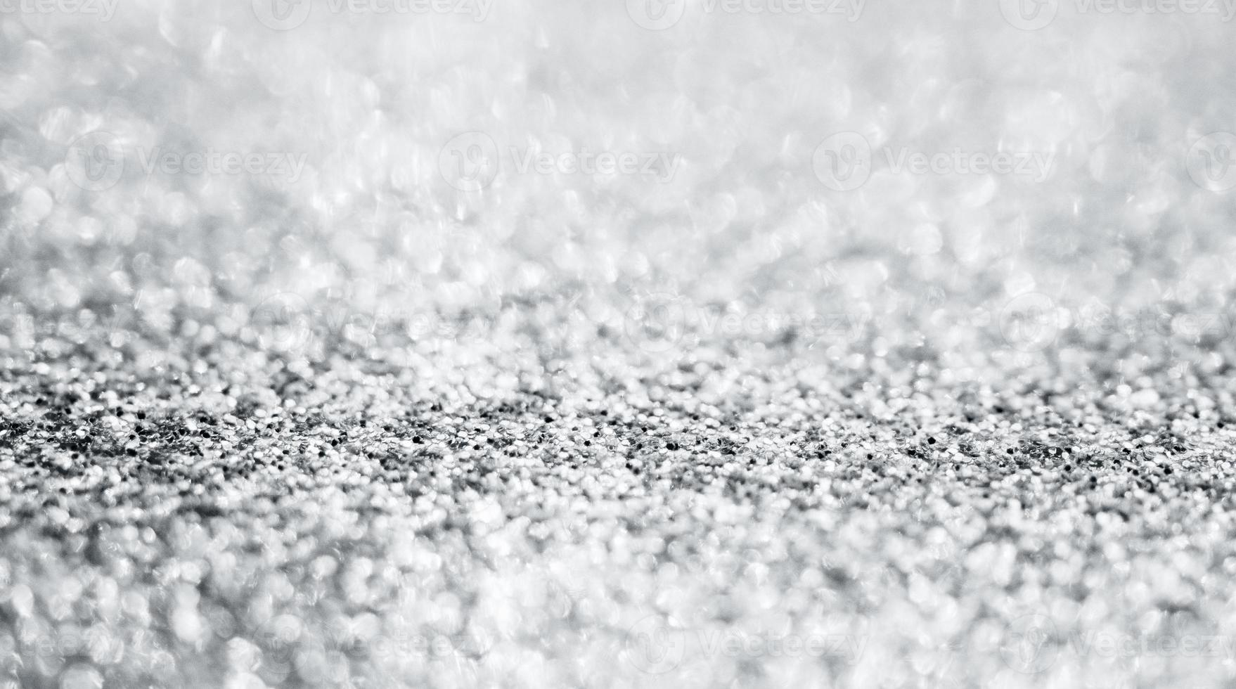 Abstract silver glitter sparkle texture with bokeh background photo