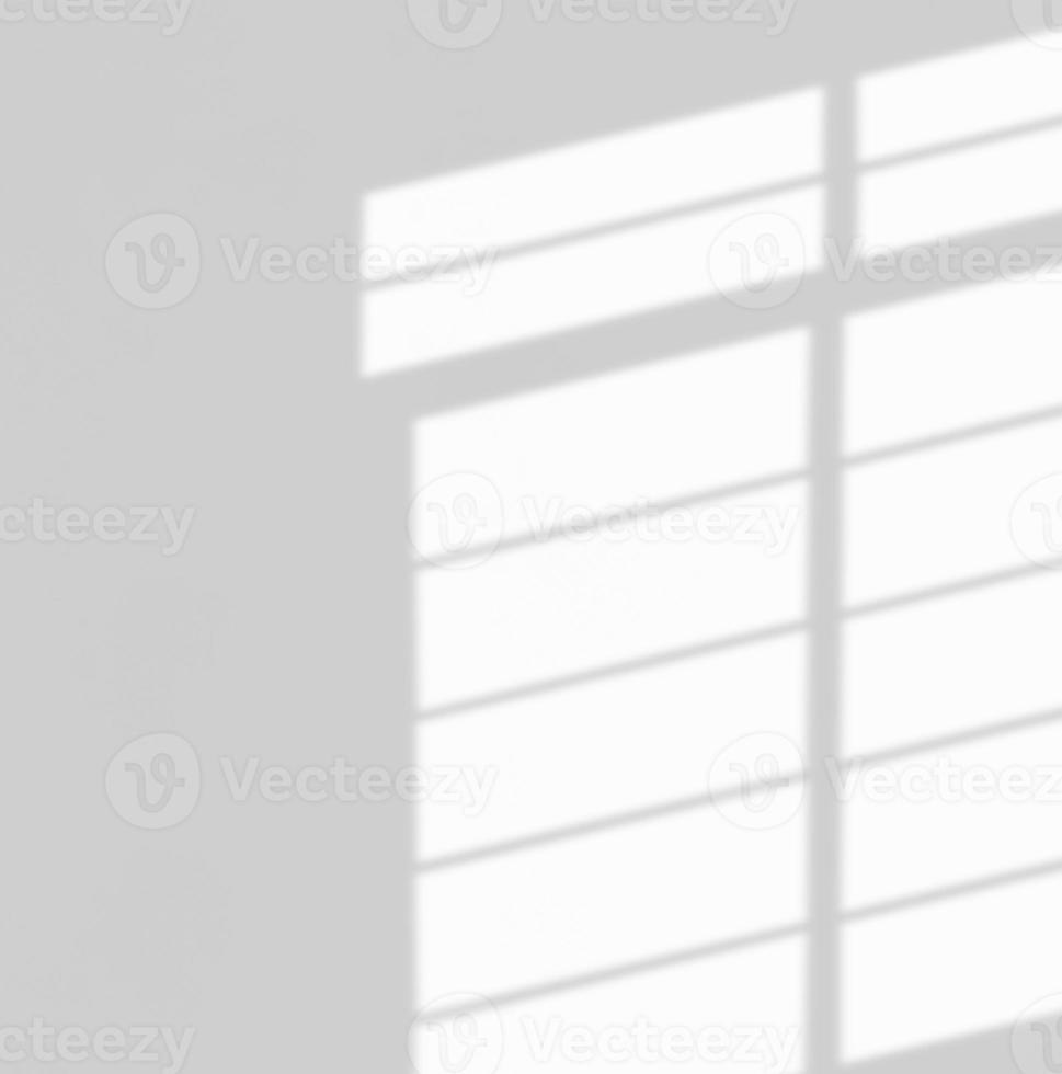 Window shadow drop on white wall background photo