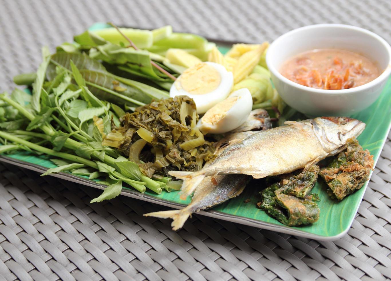 Fried Mackerel fish,chili sauce and fried vegetable photo