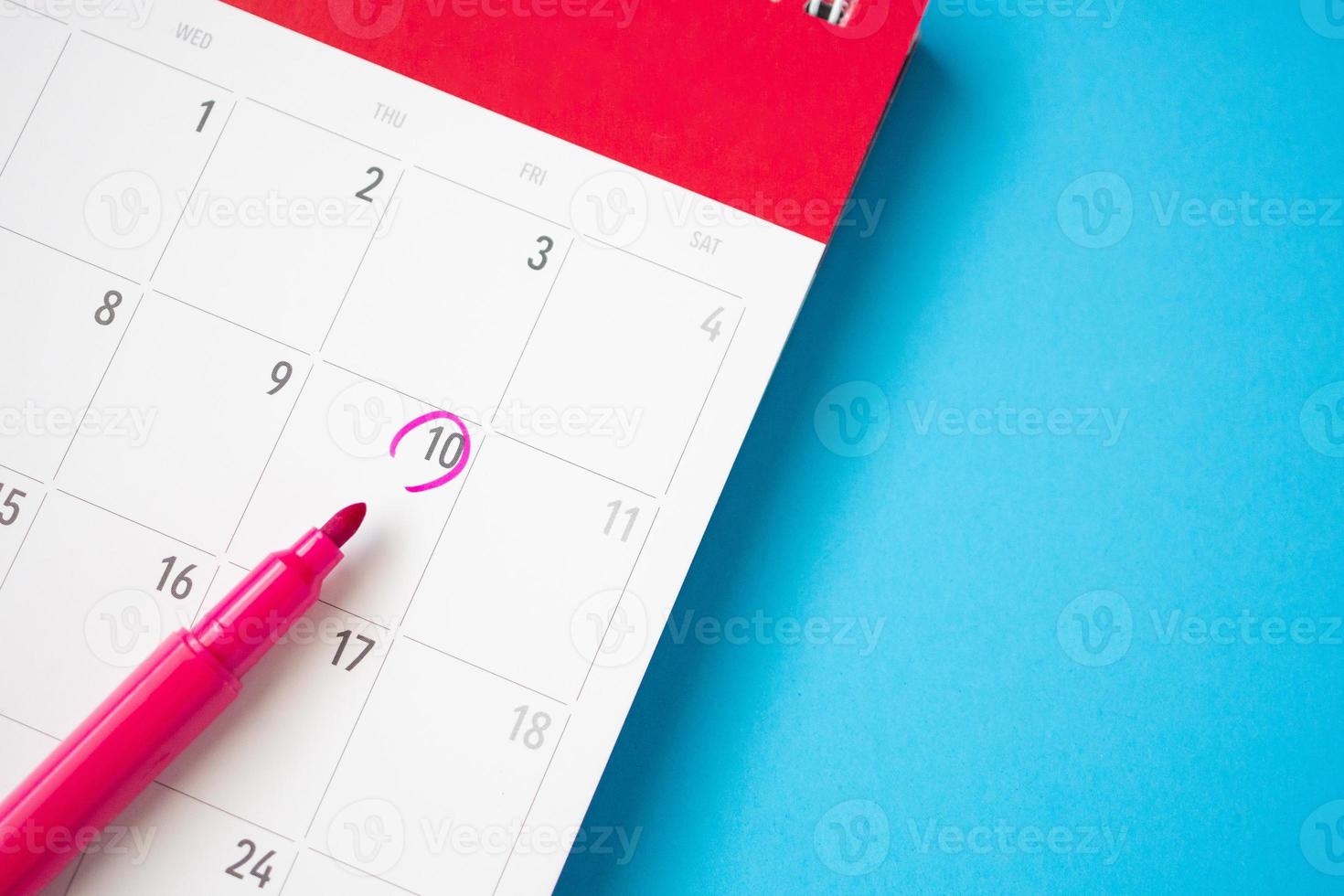 important appointment schedule write on white calendar page date on blue background photo