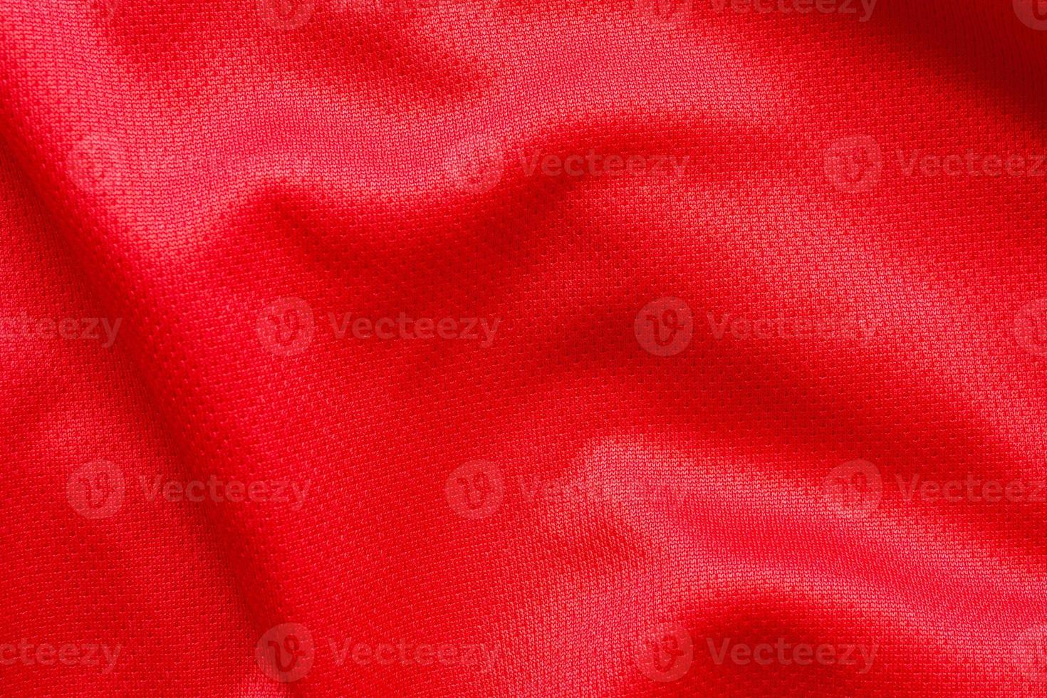 Fondo de textura de jersey de camiseta de fútbol de tela de ropa deportiva roja foto