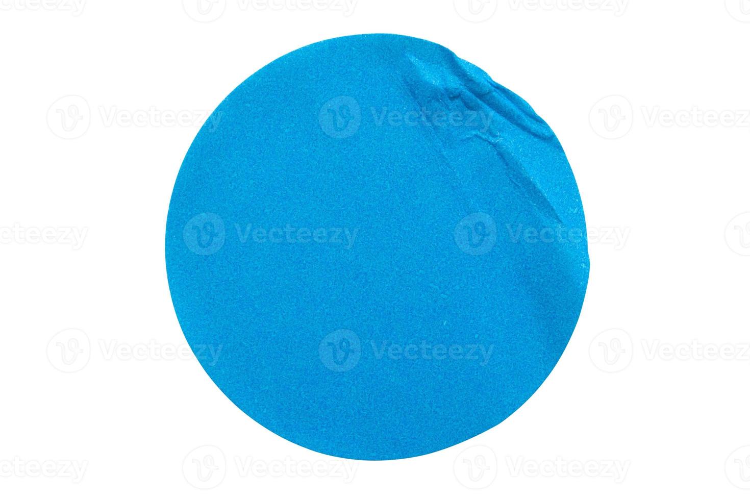 Blank blue round adhesive paper sticker label isolated on white background photo