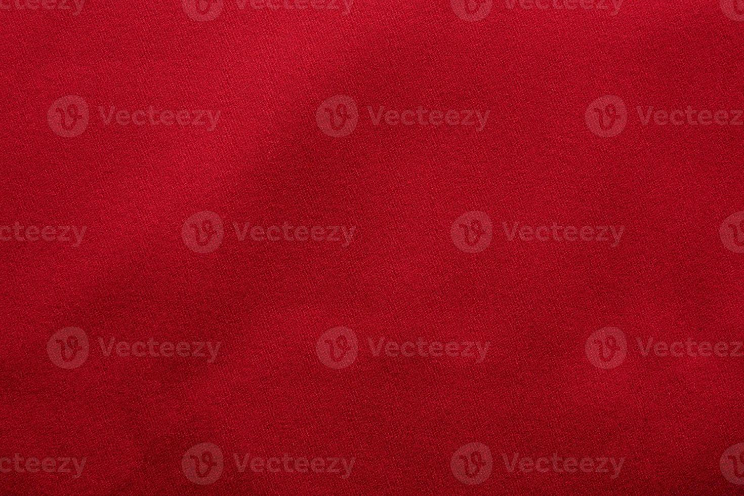Red fabric texture background close up photo