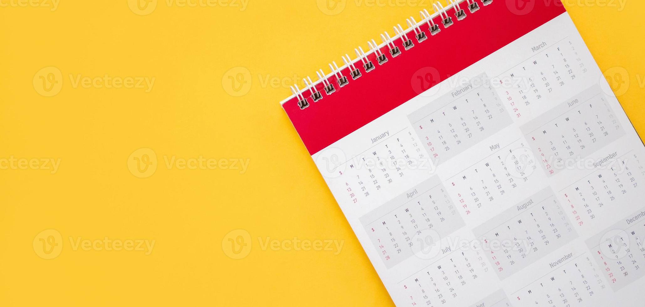 calendar page on yellow background business planning appointment meeting concept photo