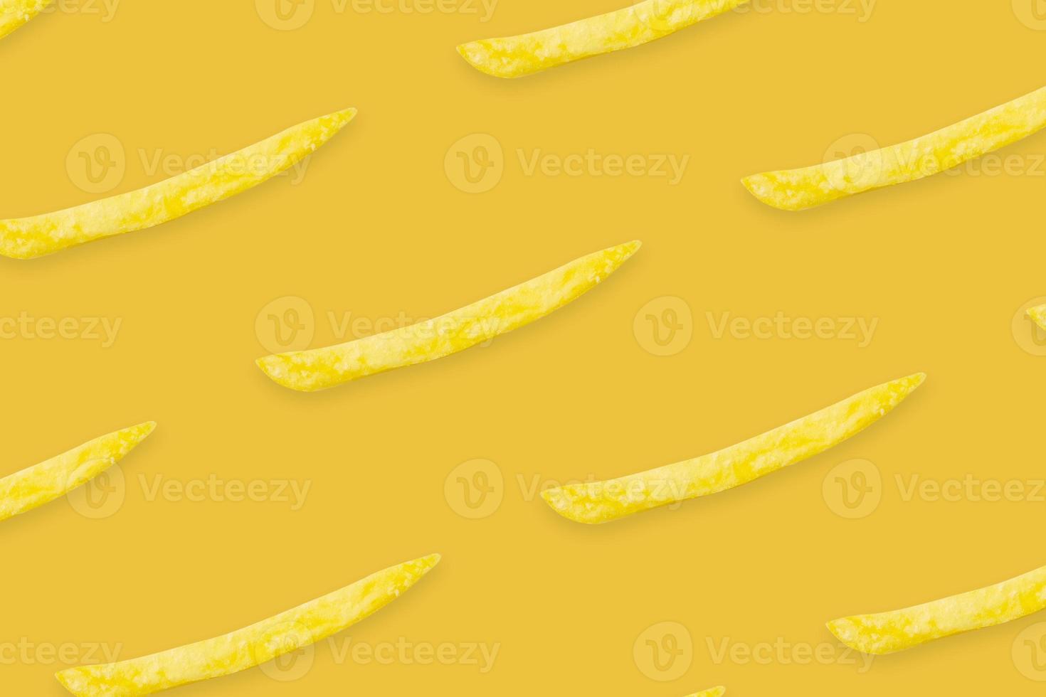french fries pattern on yellow background top view flat lay photo
