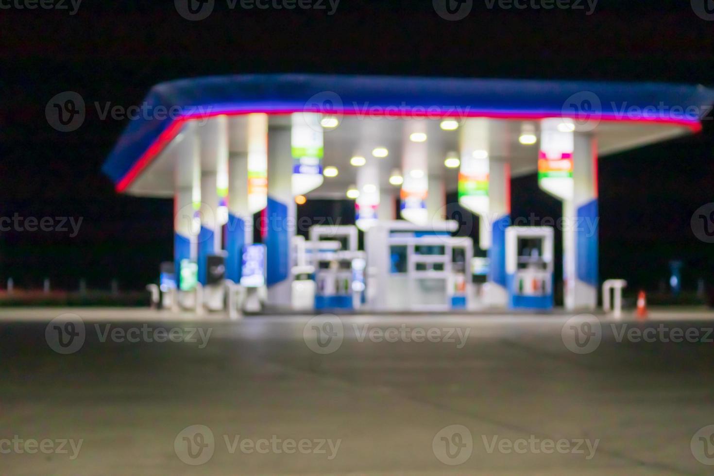 Petrol gas station at night time blurred background with bokeh light photo