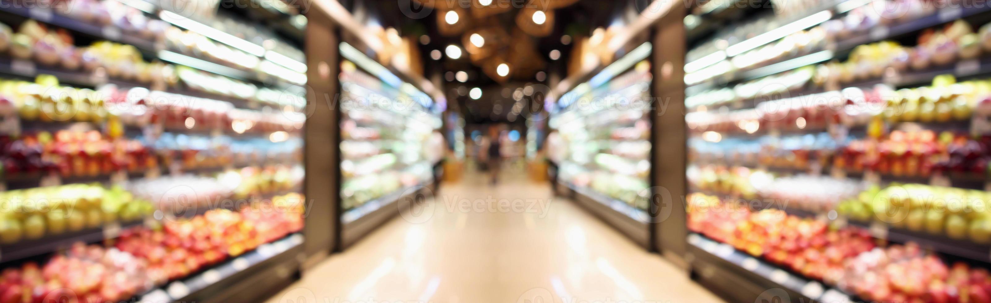 Grocery store shelves with fruits and vegetables blurred background photo