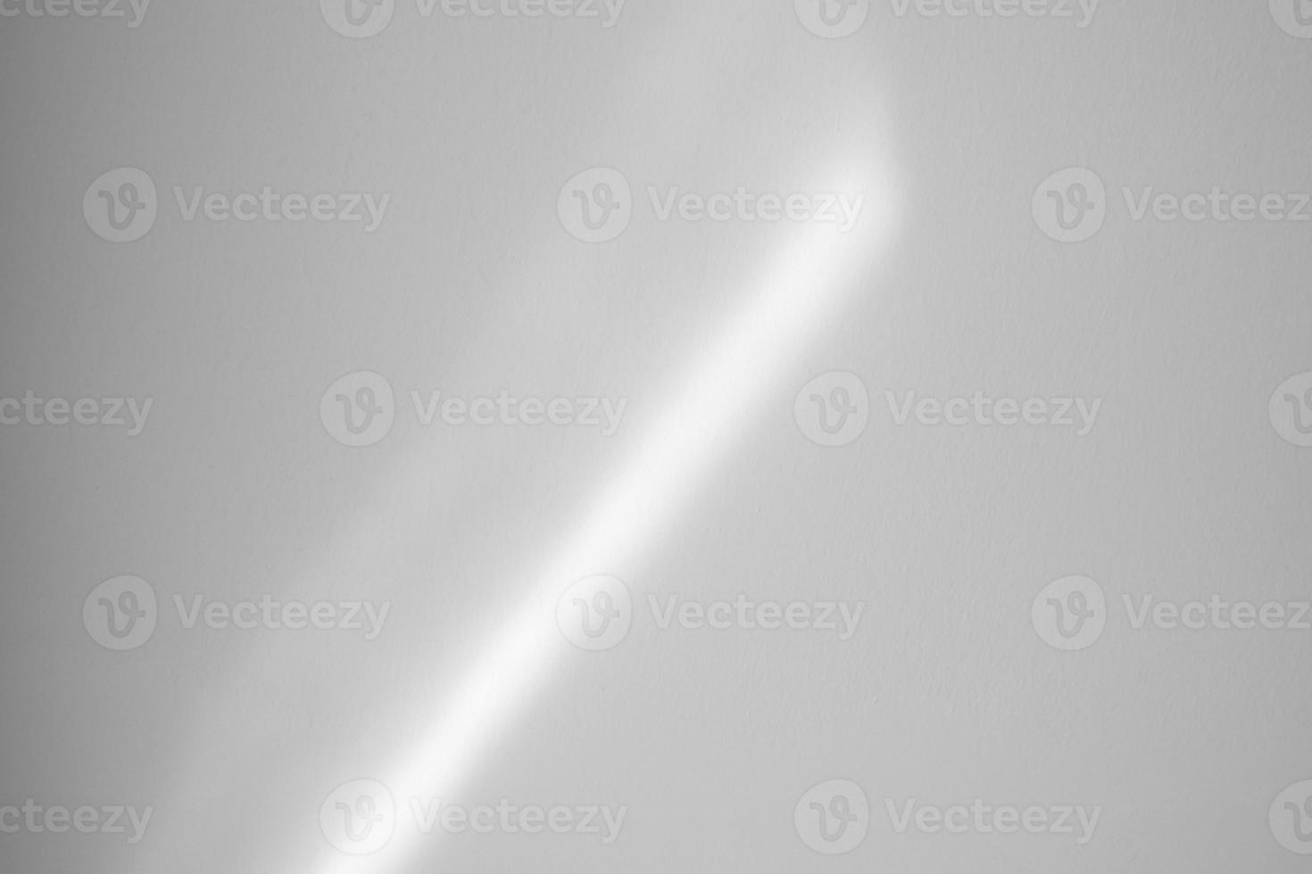 Window shadow drop on white wall background photo