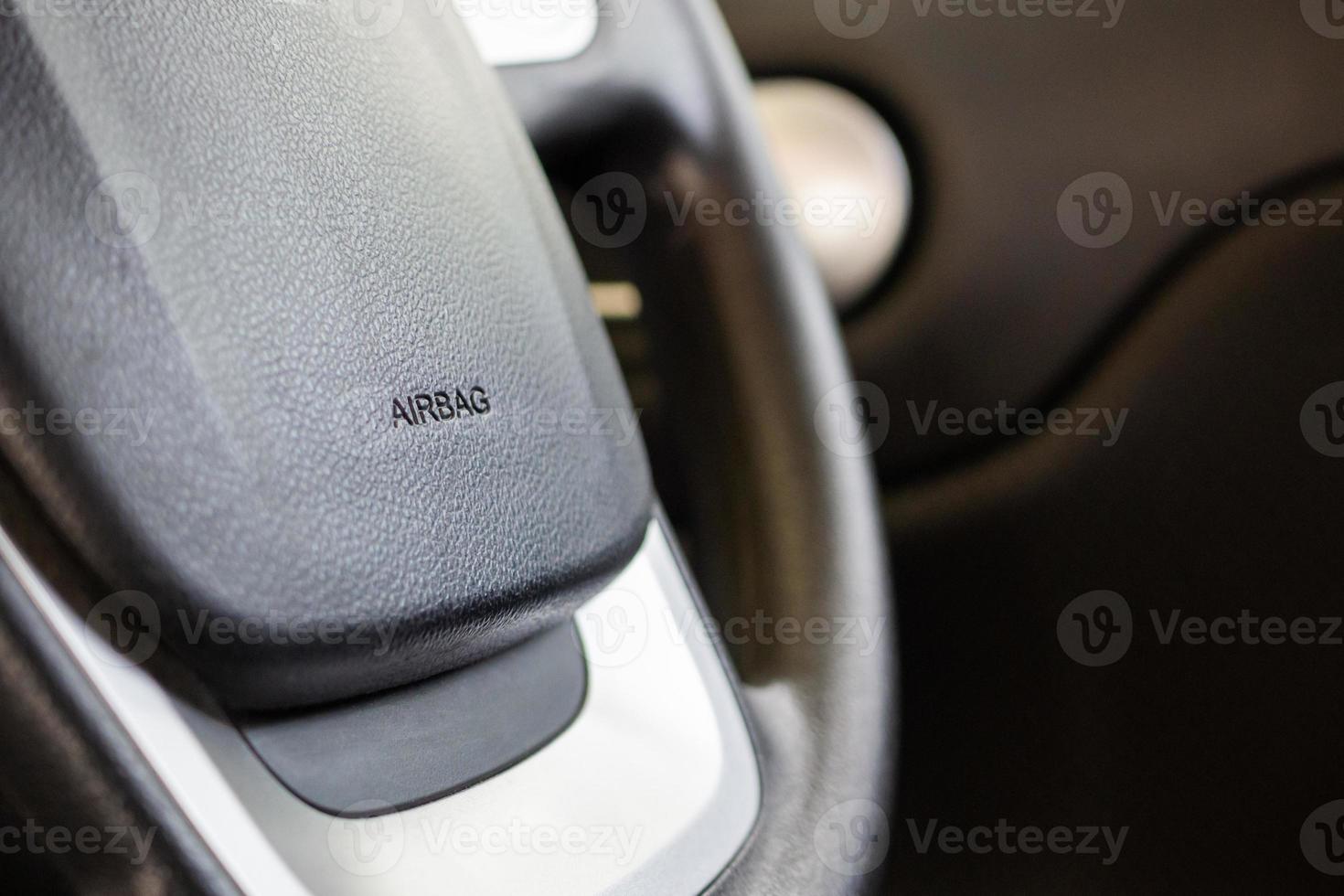 Safety airbag sign on car steering wheel photo