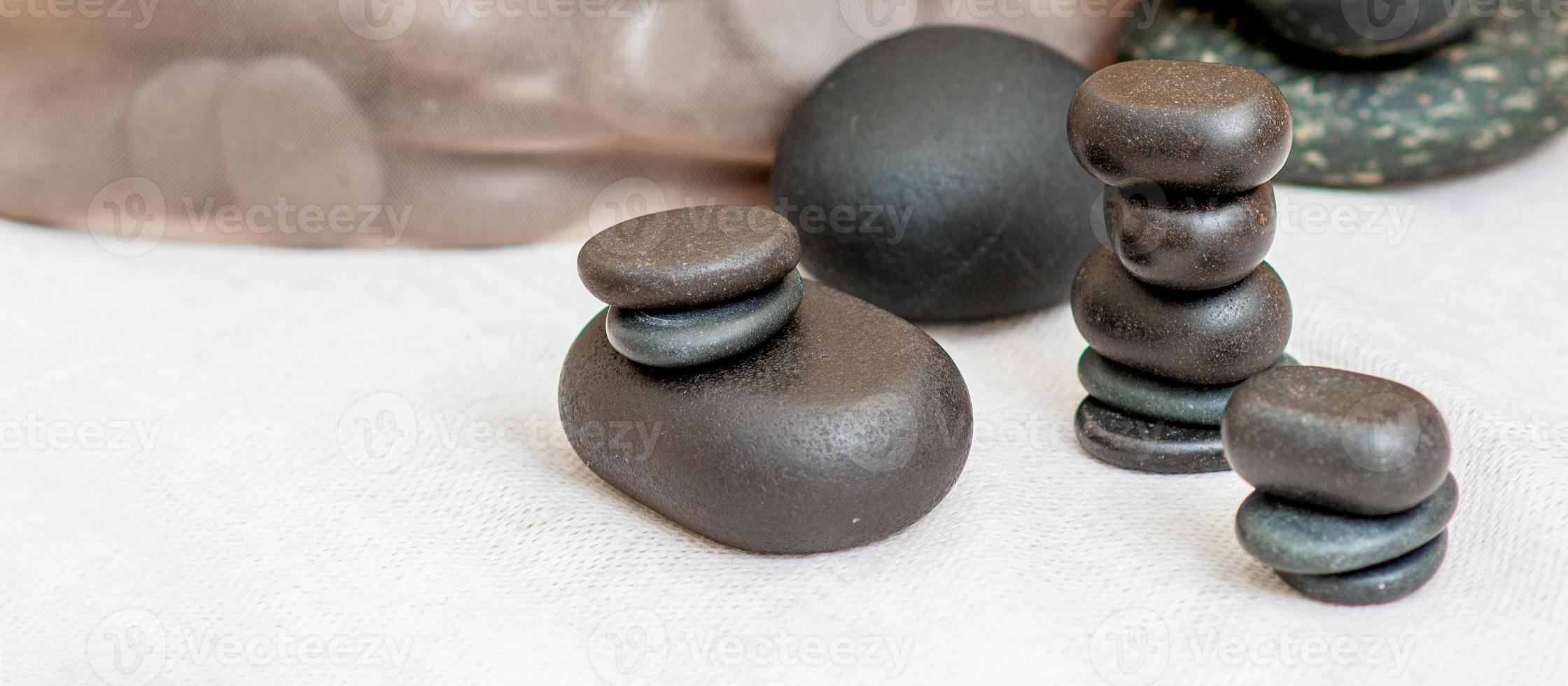 Set of massage stones on the table photo