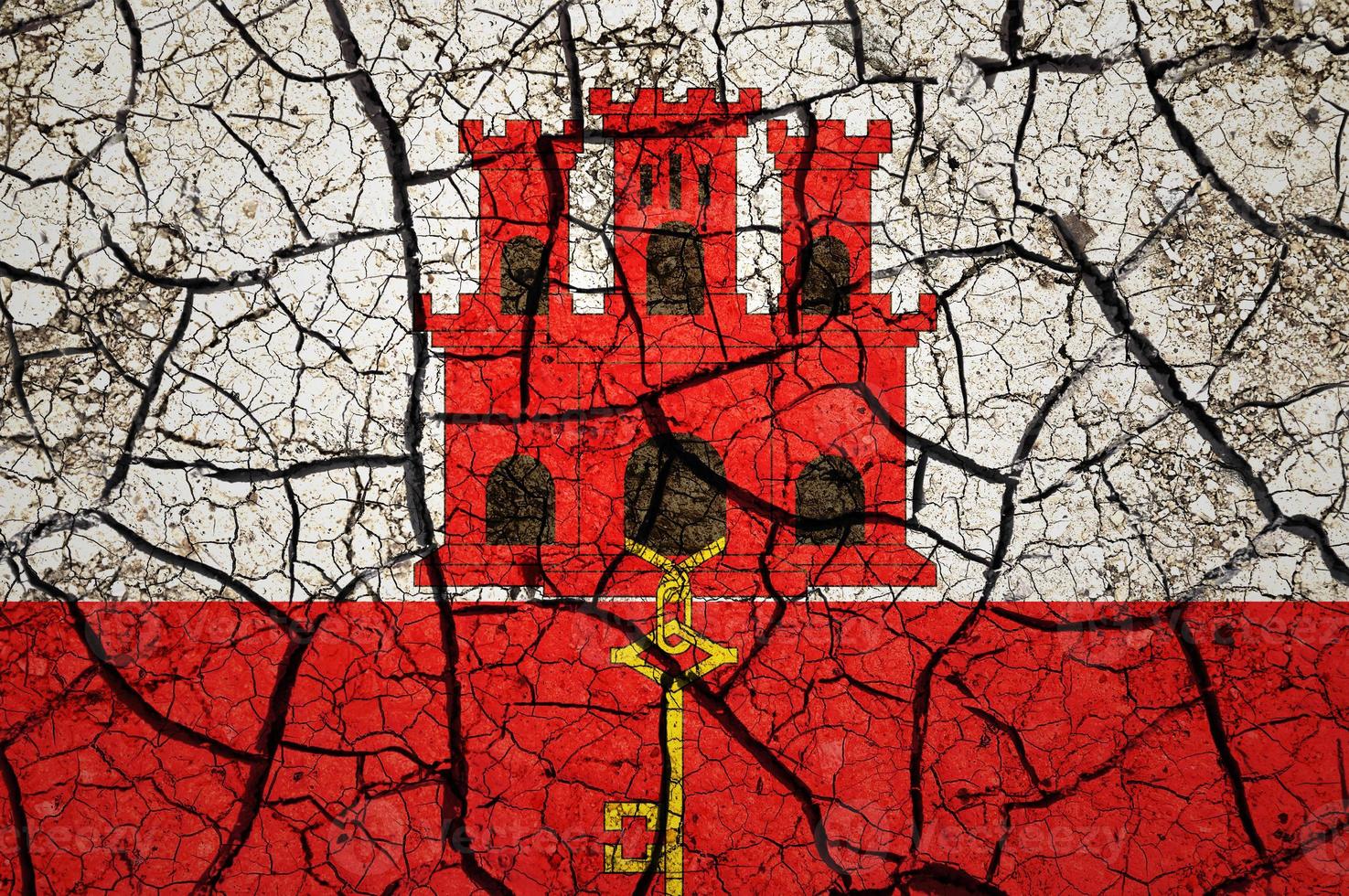 Dry soil pattern on the flag of Gibraltar. Country with drought concept