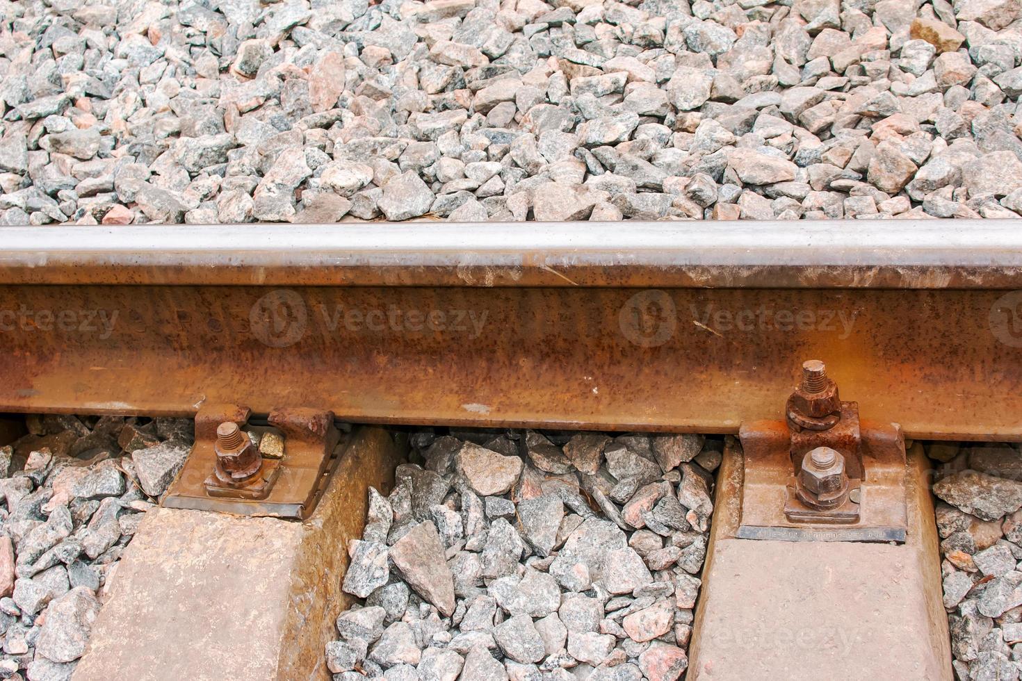 Rail rails on sleepers with bolts and nuts photo