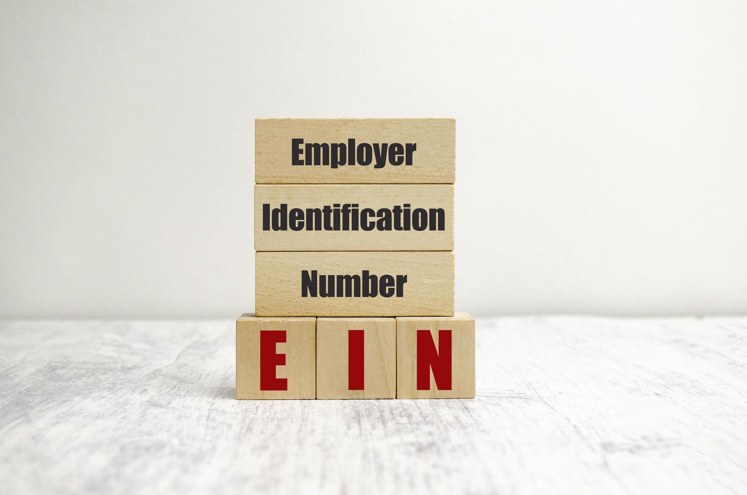 employer identification number on wooden blocks and white background photo