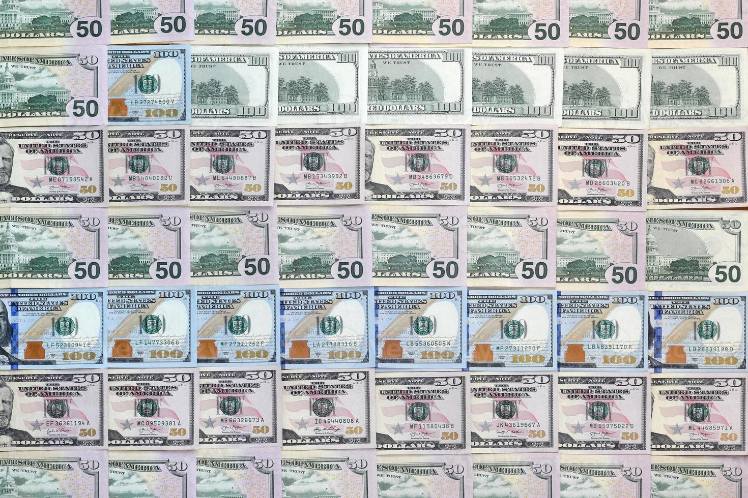 Many one hundred and fifty dollar bills on flat background surface close up. Flat lay top view photo
