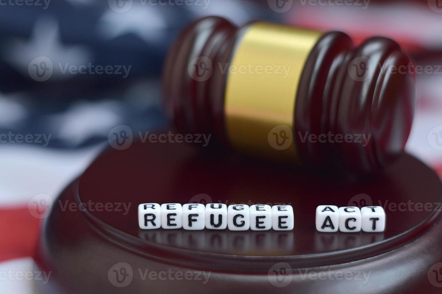 Justice mallet and Refugee act characters with US flag on background photo