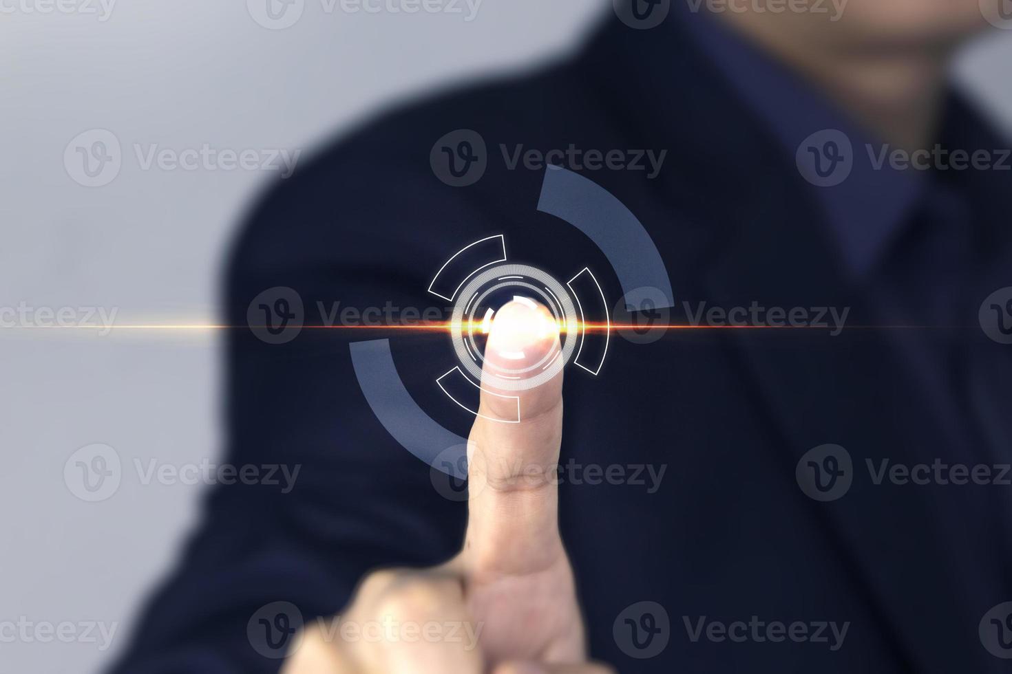 Businessman touches on LIGHT Flar of technology screen, a man finger touching LIGHT effect, and clicking virtual screen, used in business and metaverse technology photo
