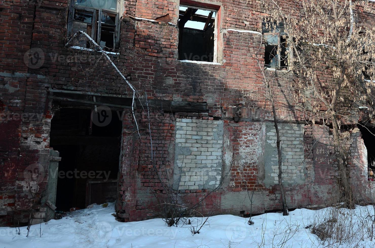Fragment of an abandoned two-story building after military operations in Donetsk photo