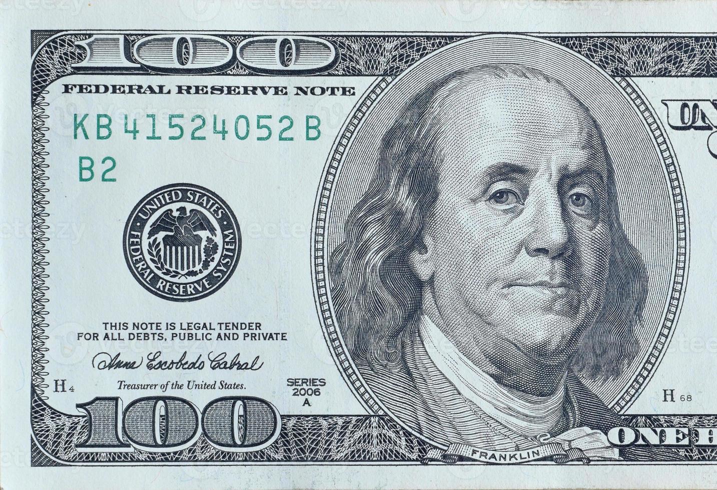 Portrait of US president Benjamin Franklin on 100 dollars banknote closeup macro fragment. United states hundred dollars money bill photo