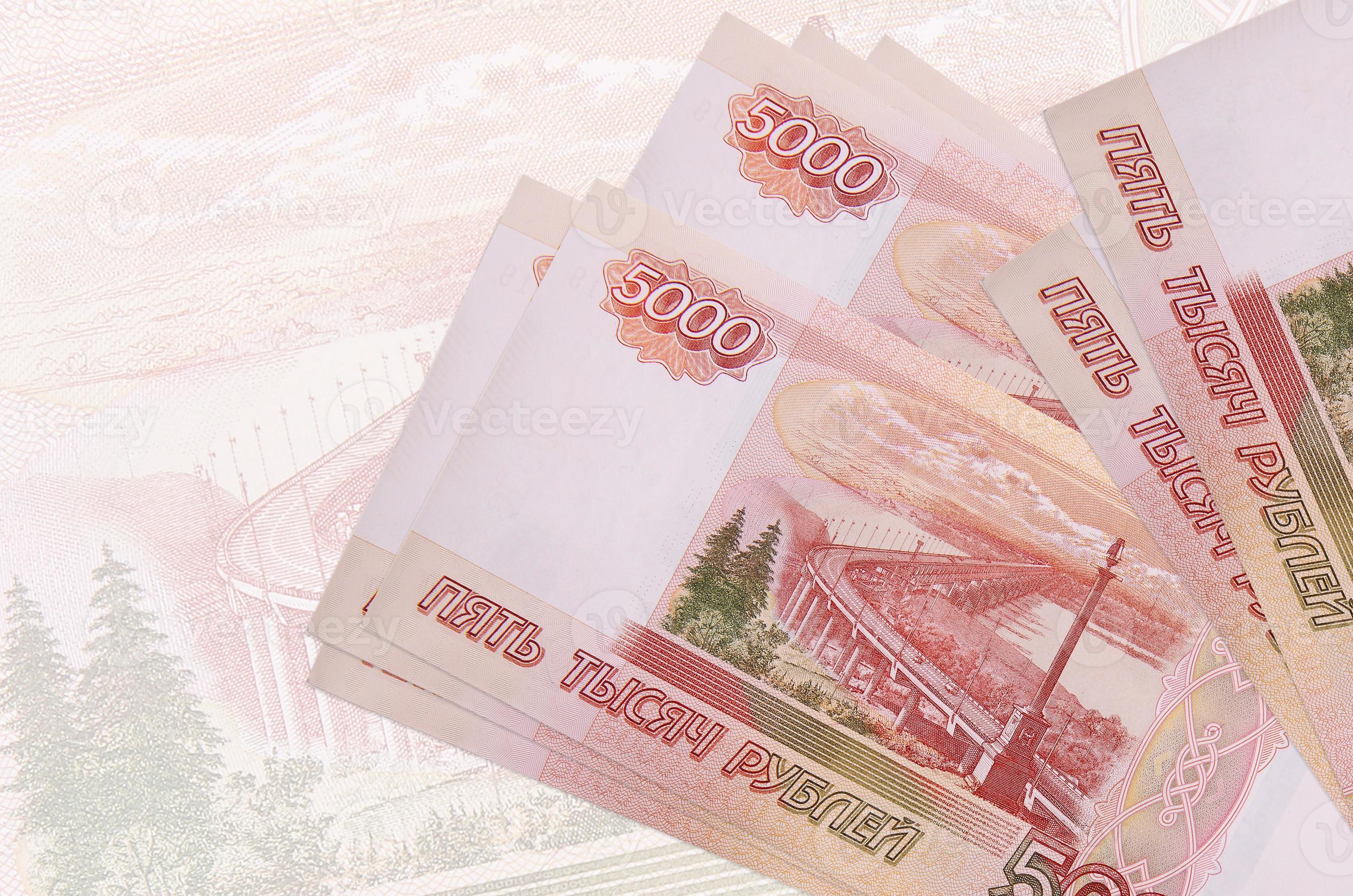 5000 Russian Rubles Bills Lies In Stack On Background Of Big Semi 5000-russian-rubles-bills-lies-in-stack-on-background-of-big-semi