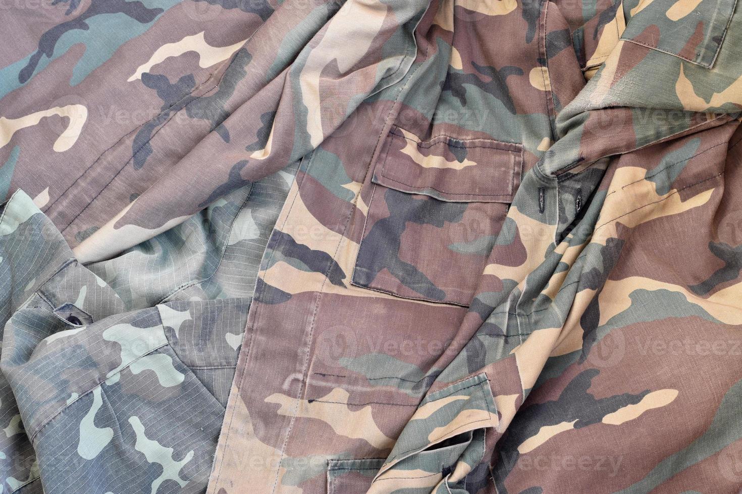 Camouflage background texture as backdrop for hunting or fishing design projects photo
