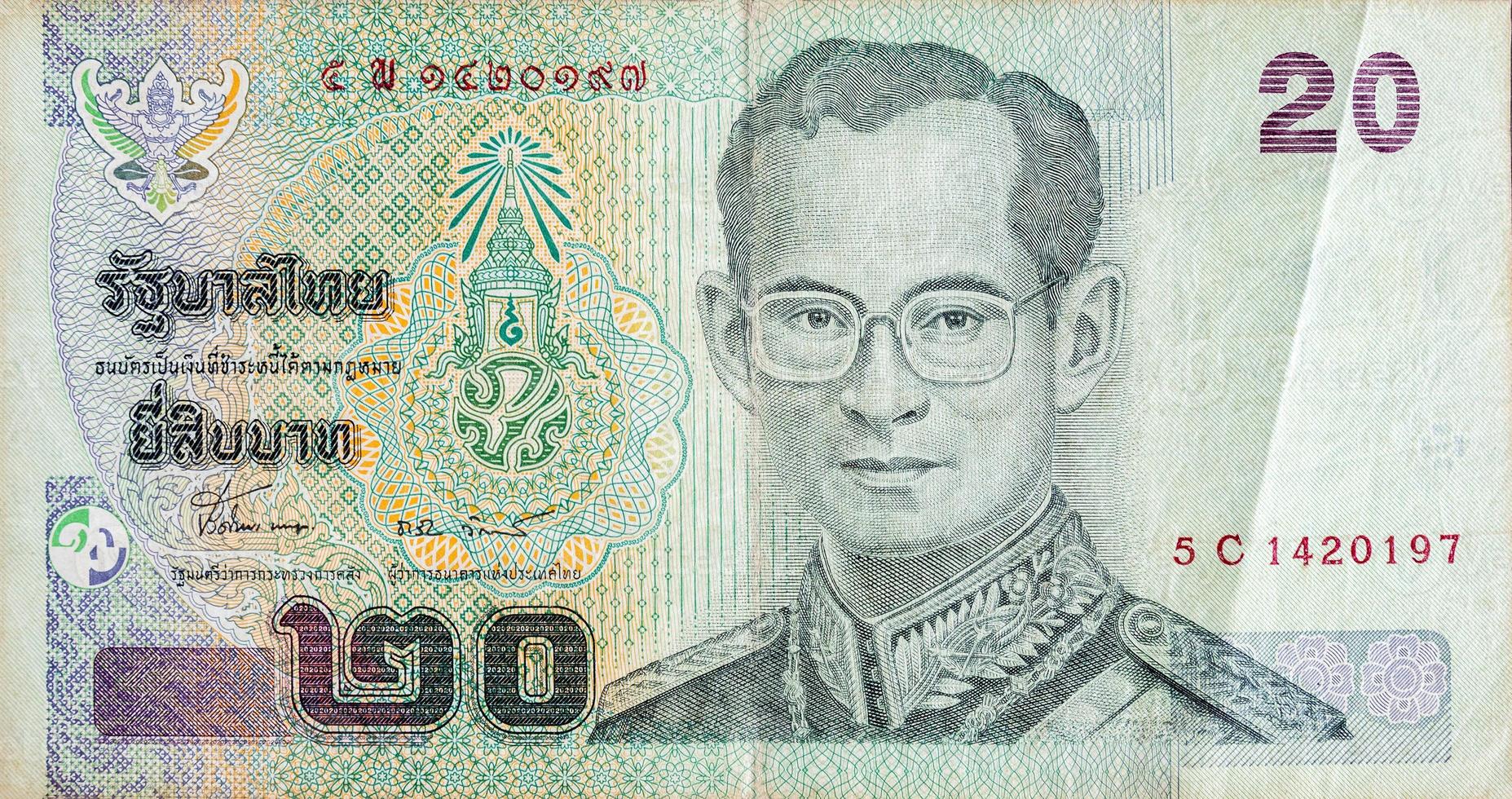 King Bhumibol Adulyadej on 20 Baht Thailand money bill close up photo