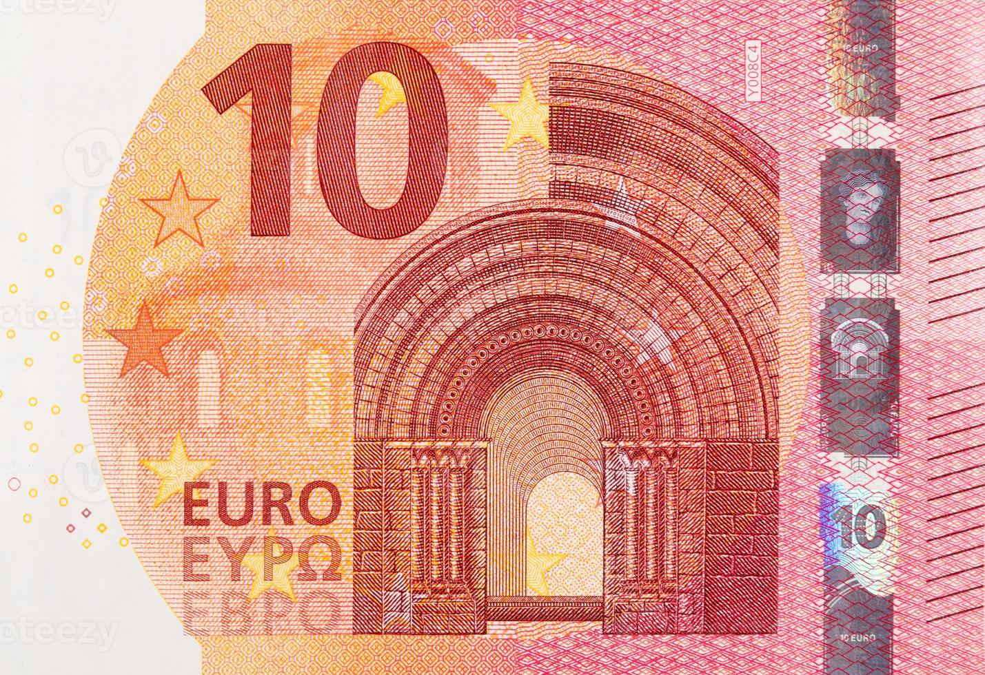 Fragment part of 10 euro banknote close-up with small red details photo