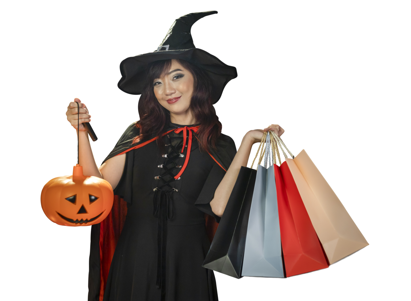 Asian girl in witch costume holding jack o lantern and shopping sale bag for halloween party trick or treat concept isolate on orange background png