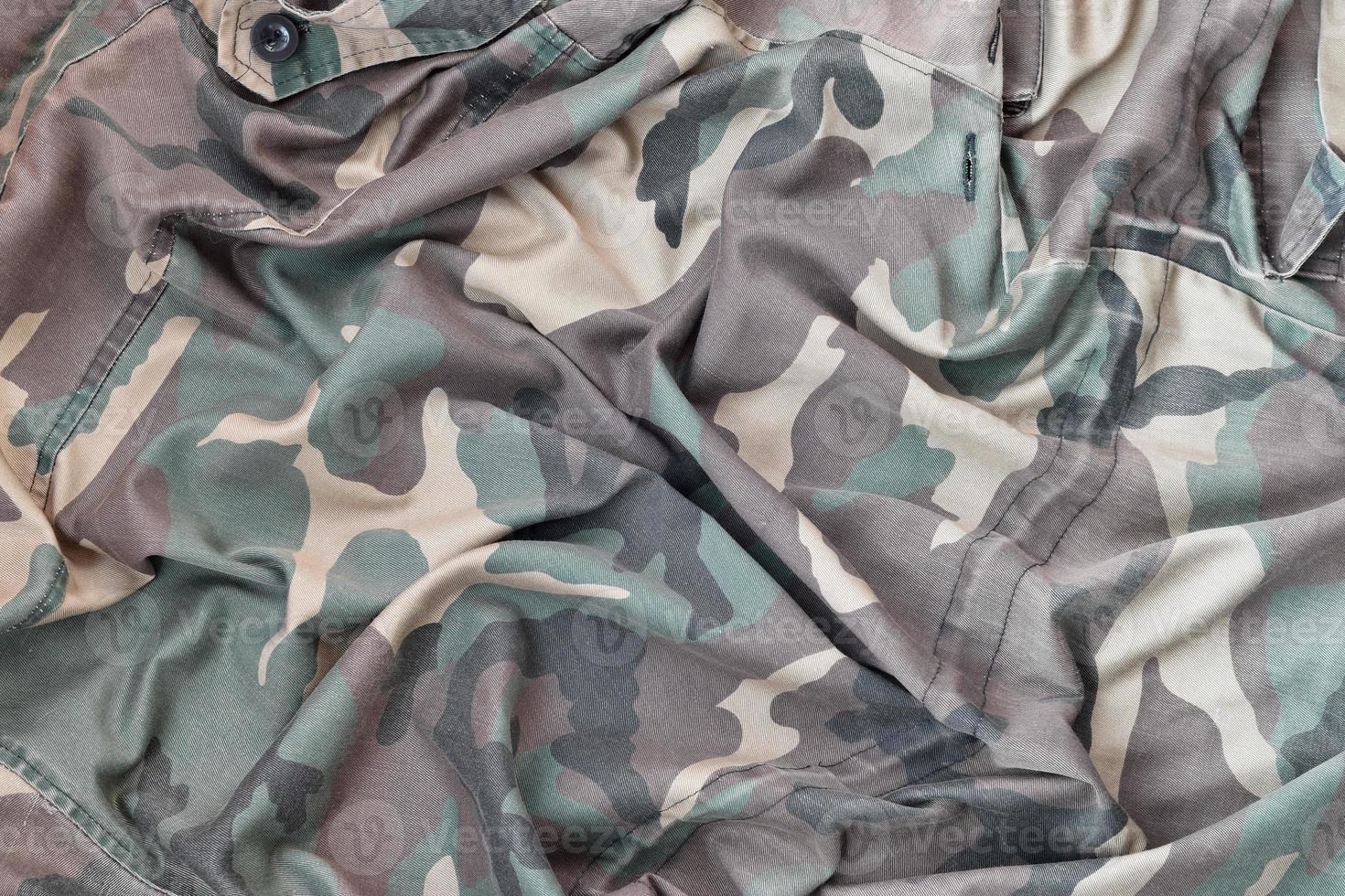 Camouflage background texture as backdrop for military video games and design projects photo