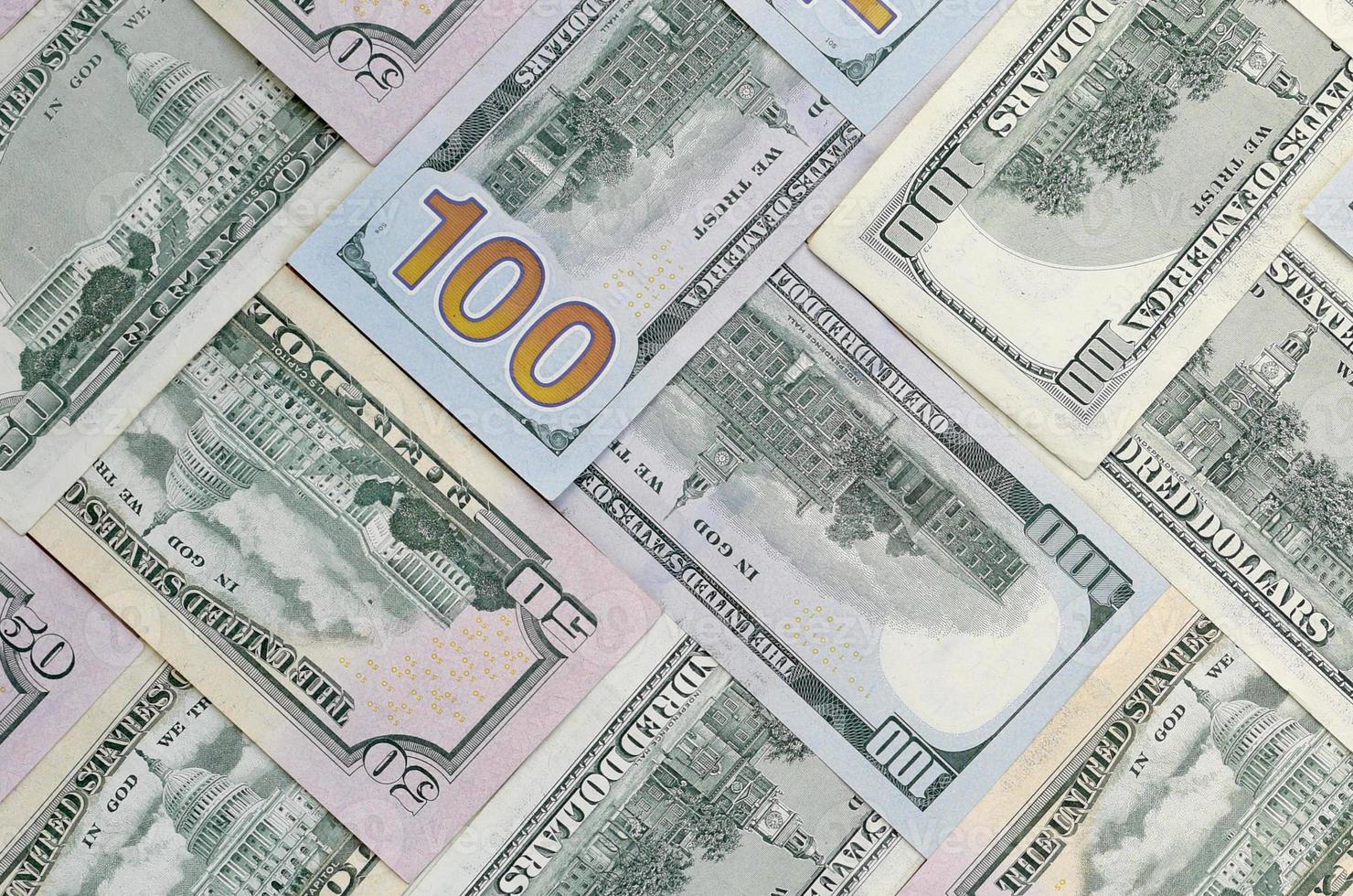 Many one hundred and fifty dollar bills on flat background surface close up. Flat lay top view photo