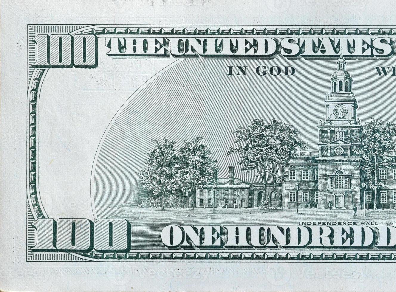 Independence Hall on 100 dollars banknote back side closeup macro fragment. United states hundred dollars money bill photo