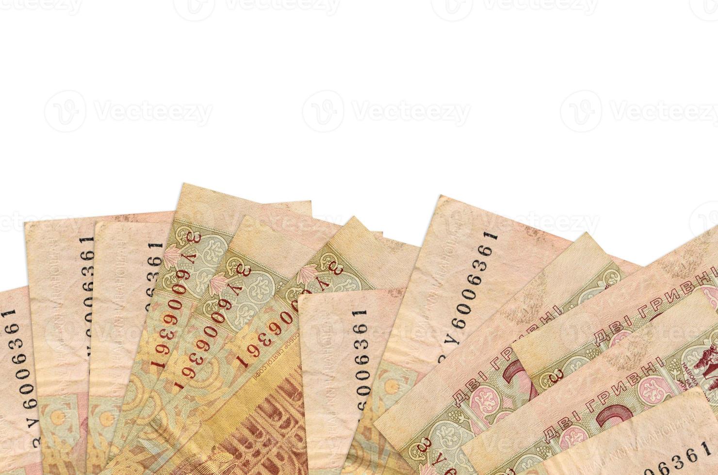 2 Ukrainian hryvnias bills lies on bottom side of screen isolated on white background with copy space. Background banner template photo