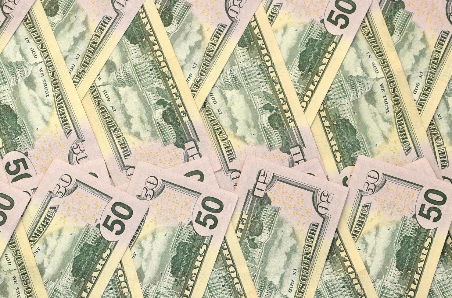 Many one hundred and fifty dollar bills on flat background surface close up. Flat lay top view photo