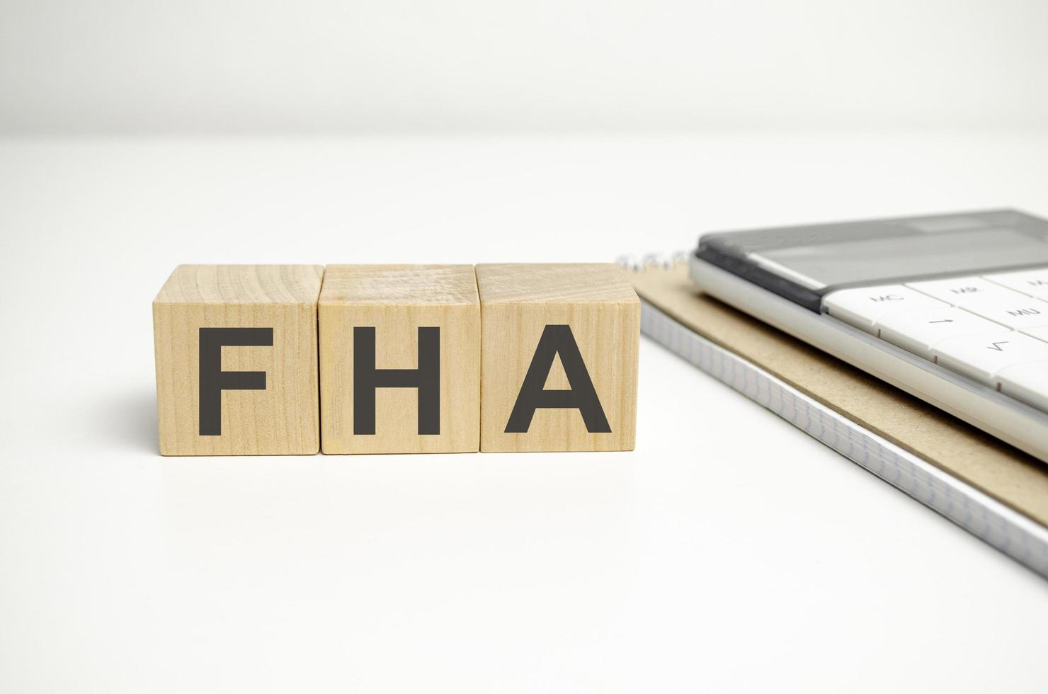 Wooden cubes form the word FHA, federal housing administration photo