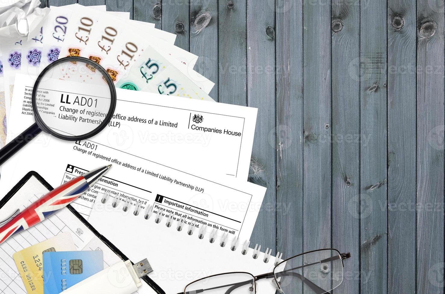 English form LLAD01 Change of registered office address of a limited liability partnership LLP from Companies House service lies on table with office items photo