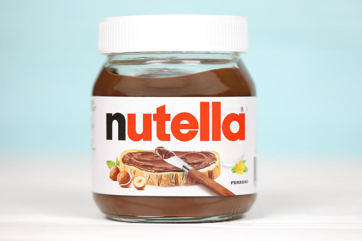 KHARKOV, UKRAINE - DECEMBER 27, 2020 Nutella classic glass can. Nutella is manufactured by Italian company Ferrero first introduced in 1964 photo
