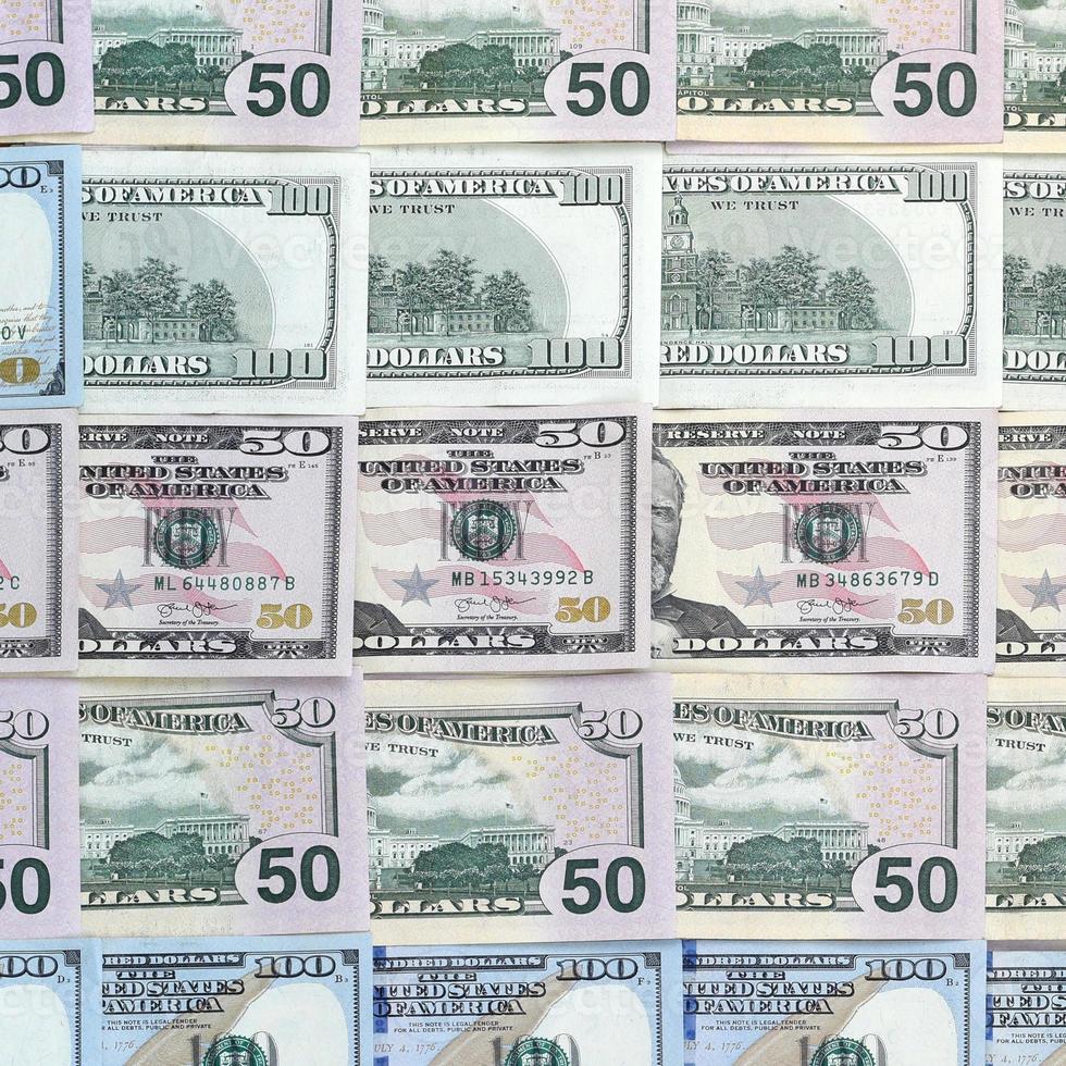 Many one hundred and fifty dollar bills on flat background surface close up. Flat lay top view photo