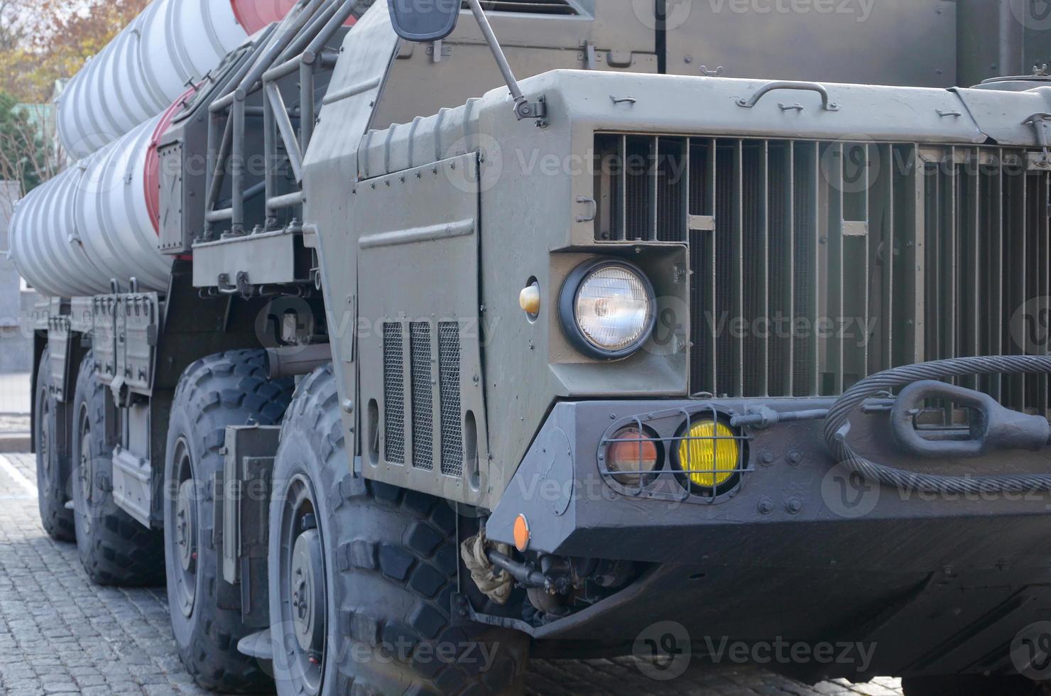 Close up of green military truck. Modern military transportation vehicle technologies photo