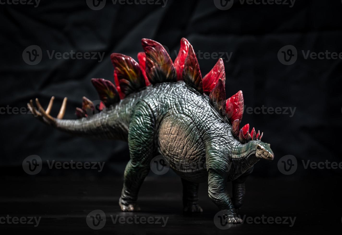 dinosaur , Stegosaurus in the dark photo