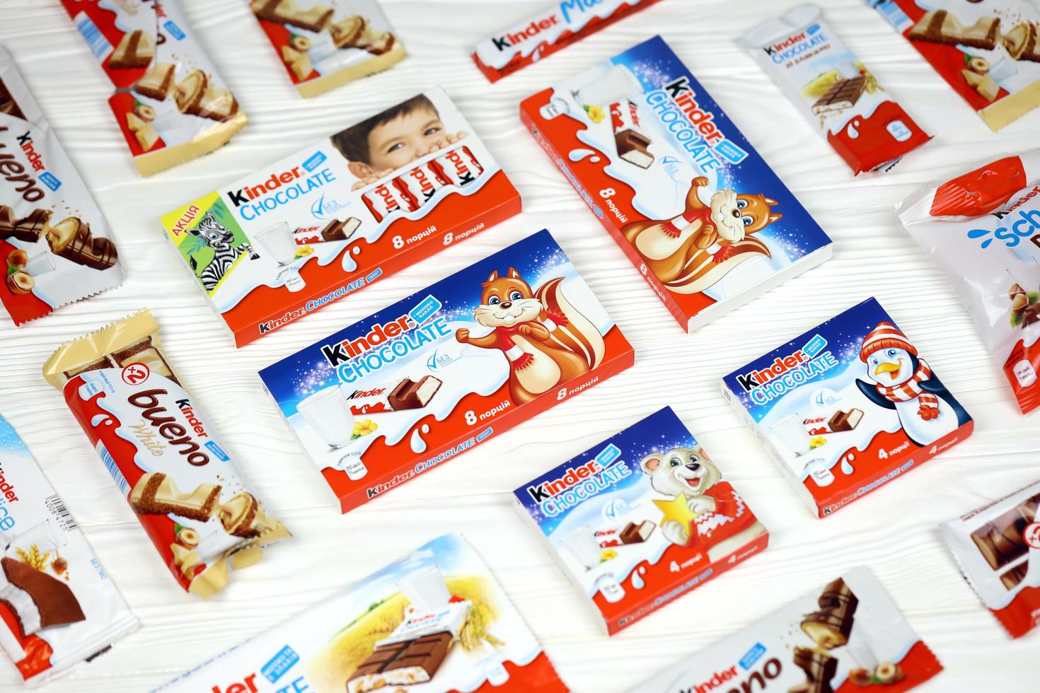 KHARKOV, UKRAINE - DECEMBER 8, 2020 Many different products by Kinder brand made by Ferrero SpA. Kinder is a confectionery product brand line of Italian manufacturer Ferrero photo