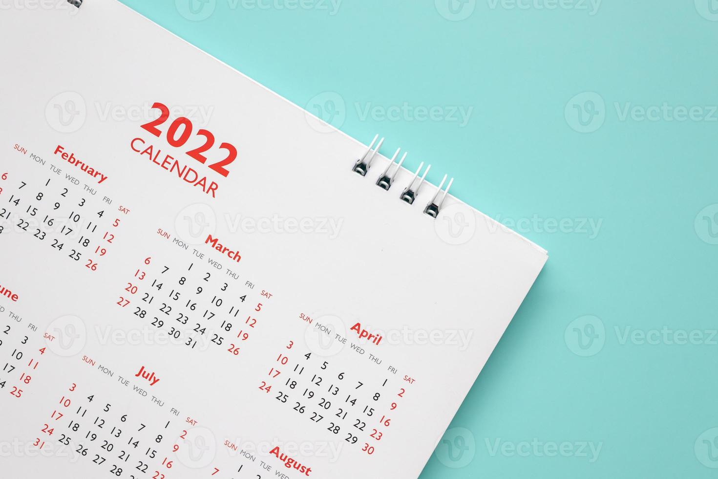 2022 calendar page on blue background business planning appointment meeting concept photo