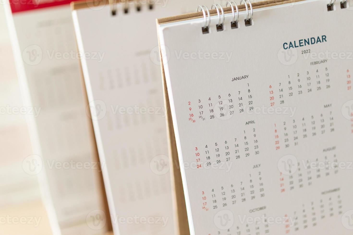 Close up calendar page dates and month background business planning appointment meeting concept photo