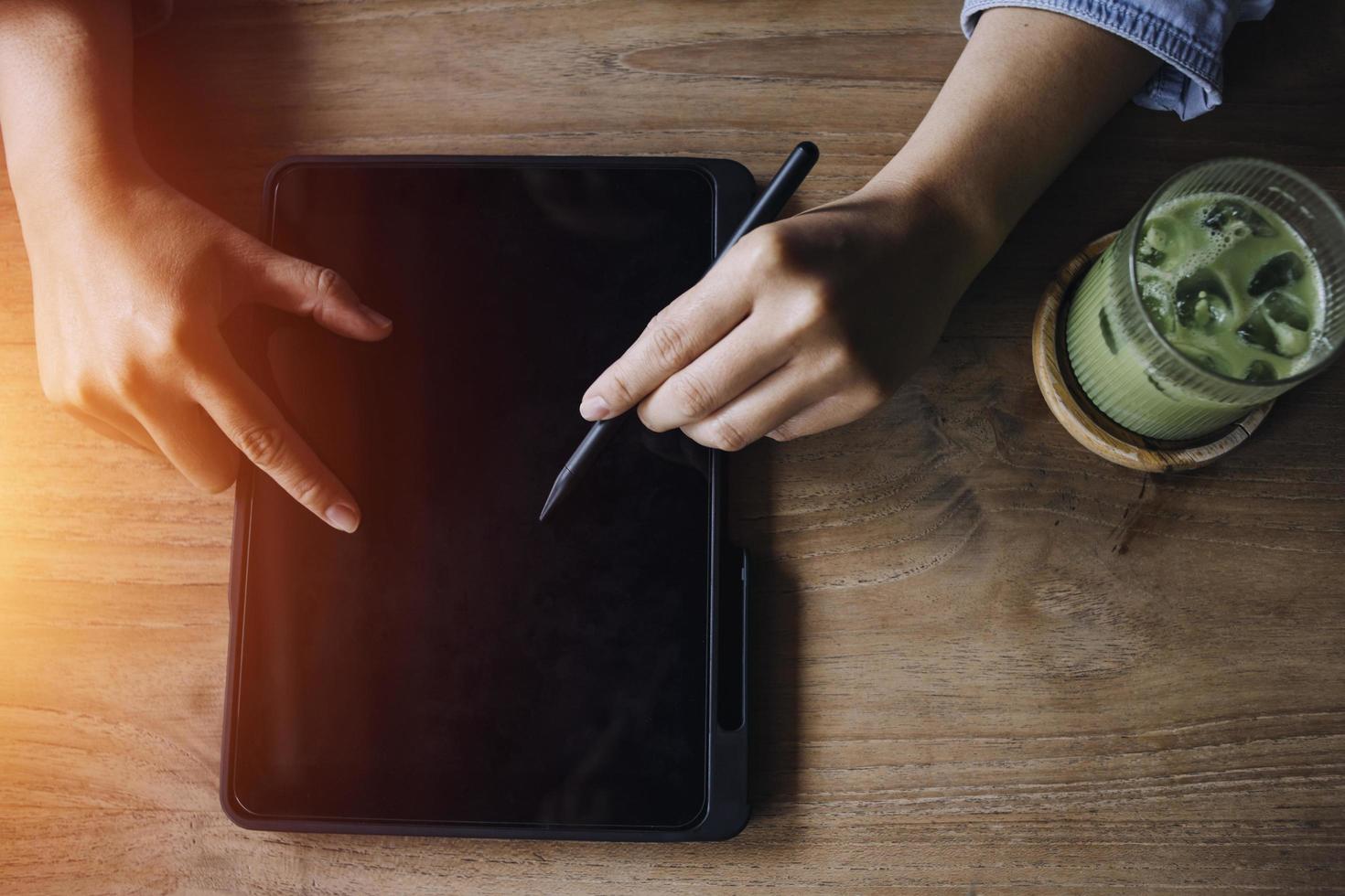 businesswoman hand working with laptop computer, tablet and smart phone in modern office with virtual icon diagram at modernoffice in morning light photo