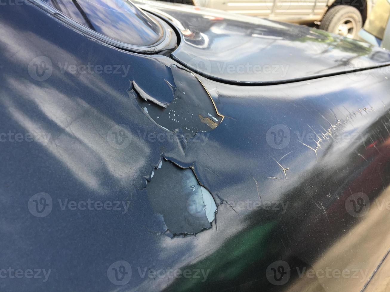 The paint sheet on the outside surface of the car is cracked into various shapes according to the condition and time of use of the car photo